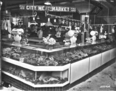 City Meat Market, stall #123 at the Crystal Palace Market. The market was owned by C.M. Wirges and T.J. Kenney and was also located at 314 So. 11th